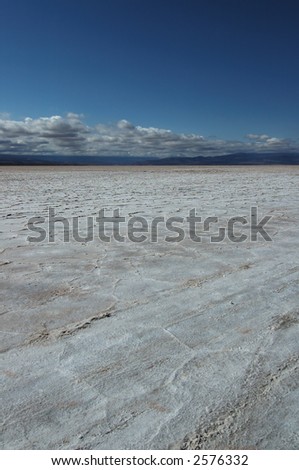 Picture showing a salt lake landscape, called Salinas Grande, near Argentina. This is where salt is exploited. vertical framing