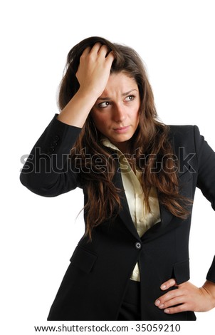 This is an image of a business woman with her hands on her head due to business failure.