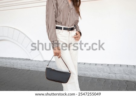 Similar – Image, Stock Photo Trendy woman with bag standing near lake