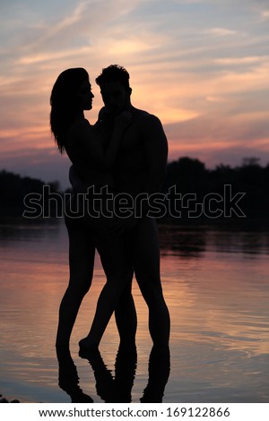 silhouette happiness and romantic scene of love couples partners on the beach.