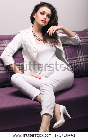 Sofa Woman relaxing enjoying luxury lifestyle day dreaming and thinking.