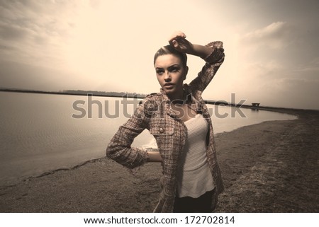 Stunning young woman posing outdoor .Fashion colors,wide angle.