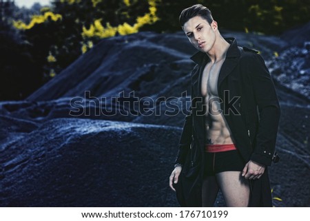 Outdoor natural portrait of a gorgeous male fitness model.Fashion colors