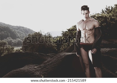 Outdoor natural portrait of a gorgeous male fitness model.Fashion colors