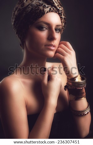 Egyptian Style Woman. Golden Jewels. Egypt Styled Makeup. Gold Light. Jewellery