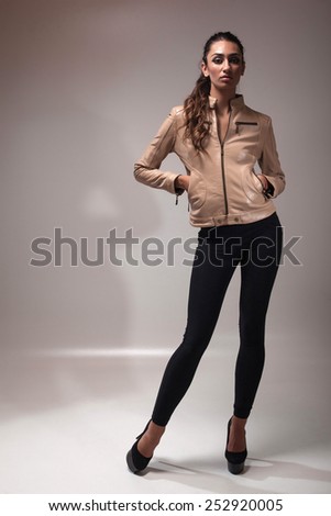 Fashion photo of young magnificent woman. Girl posing. Attractive sexy brunette woman posing.Studio photo