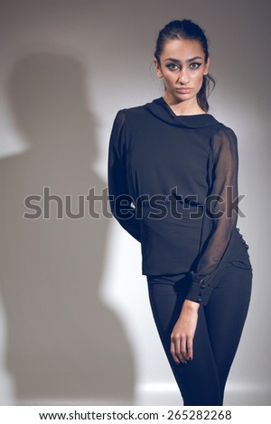 Fashion photo of young magnificent woman. Girl posing. Attractive sexy brunette woman posing.Studio photo