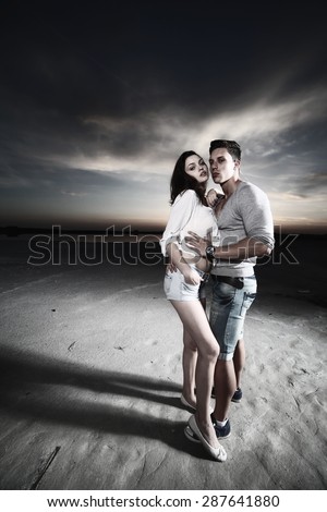 young couple in love having holidays on the sea. Fashion colors.Wide angle.