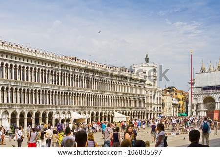 VENICE, ITALY - MAY 4: Piazza San Marco (St Mark\'s Square) is the principal public square of Venice. It\'s always crowded square in front of San Marco Basilica. After a tide. Venice, Italy, May 4, 2012