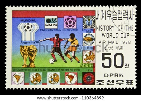 KOREA - CIRCA 1978: A Stamp printed in North Korea shows the Soccer players, Cup and Emblems with inscription and name of series \