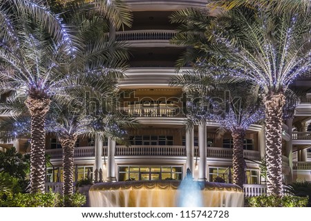 DUBAI, UAE - SEPTEMBER 29: Kempinski Hotel and Residences at night (129 luxury suites, penthouses and villas) on man-made island of Palm Jumeirah at September 29, 2012 in Dubai, United Arab Emirates.