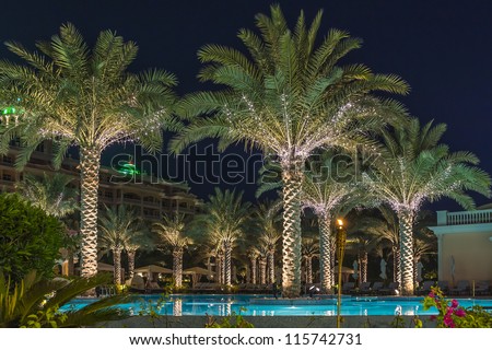 DUBAI, UAE - SEPTEMBER 29: Kempinski Hotel and Residences at night (129 luxury suites, penthouses and villas) on man-made island of Palm Jumeirah at September 29, 2012 in Dubai, United Arab Emirates.