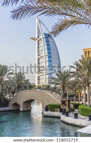 DUBAI, UAE - SEPTEMBER 29: View of Burj al Arab hotel (7 star, 1999) from territory of Madinat Jumeirah hotel at September 29,2012, Dubai, United Arab Emirates. Madinat Jumeirah - luxury 5 star hotel