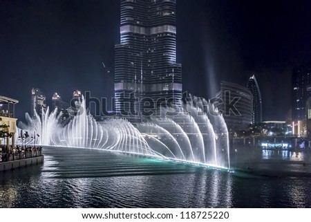 DUBAI, UAE - OCTOBER 1: A record-setting fountain system set on Burj Khalifa Lake - 6600 lights and 25 projectors, it shoots water 150 m into the air, at October 1, 2012 in Dubai, United Arab Emirate.