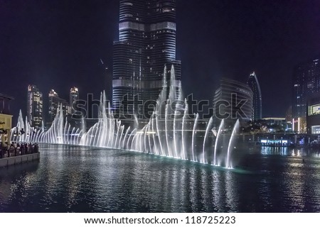 DUBAI, UAE - OCTOBER 1: A record-setting fountain system set on Burj Khalifa Lake - 6600 lights and 25 projectors, it shoots water 150 m into the air, at October 1, 2012 in Dubai, United Arab Emirate.