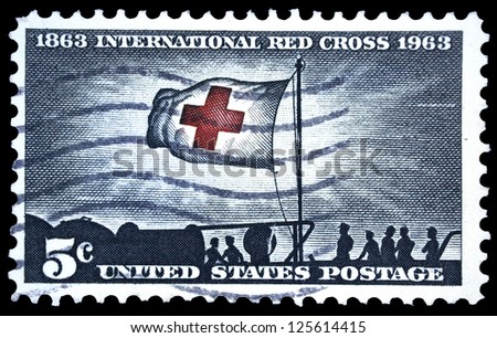 UNITED STATES OF AMERICA - CIRCA 1963: A stamp printed in USA, shows Morning Light and Red Cross Flag, with inscription and name of series \