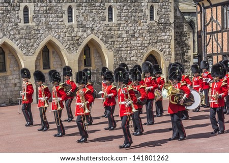 WINDSOR, ENGLAND - MAY 27: Changing Guard Ceremony takes place in Windsor Castle on May 27, 2013, Windsor, England. British Guards in red uniforms are among the most famous in the world.
