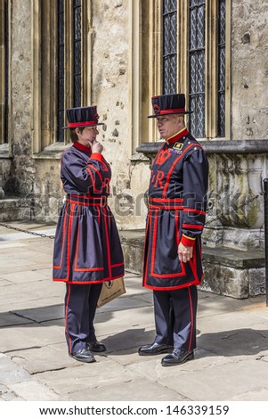 TOWER OF LONDON - MAY 26: Yeomen Warders of Her Majestys Royal Palace and Fortress Tower of London (Beefeaters) on May 26, 2013 in London. Beefeaters are ceremonial guardians of the Tower of London.