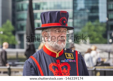 TOWER OF LONDON - MAY 26: Yeomen Warders of Her Majestys Royal Palace and Fortress Tower of London (Beefeaters) on May 26, 2013 in London. Beefeaters are ceremonial guardians of the Tower of London.