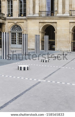 PARIS - JULY 13, 2012: Columns Buren (1985) in Palais-Royal. Palais-Royal (1639, originally called Palais-Cardinal) it was personal residence of Cardinal Richelieu in Paris, France.
