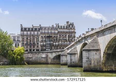 The picturesque embankments of the Seine in Paris, France. Buildings and trees.