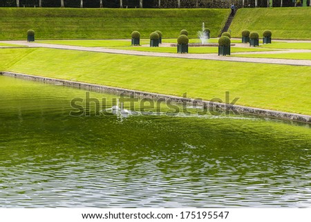 VILLANDRY, FRANCE - JULY 20, 2012: Traditional french garden. Beautiful Water Garden. Chateau de Villandry is a castle-palace located in Villandry. It is a world known for its amazing gardens