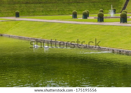 VILLANDRY, FRANCE - JULY 20, 2012: Traditional french garden. Beautiful Water Garden. Chateau de Villandry is a castle-palace located in Villandry. It is a world known for its amazing gardens