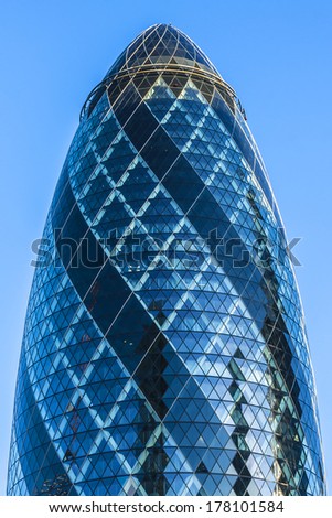 LONDON - JUNE 3, 2013: View of Gherkin building (30 St Mary Axe) at sunset in London. Gherkin - iconic symbol of London, one of city\'s most widely recognized examples of modern architecture.