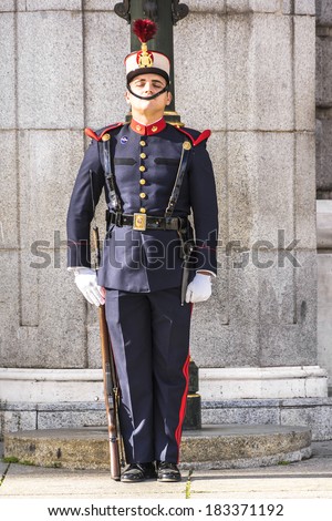 MADRID, SPAIN - NOVEMBER 20, 2013: Spanish Royal Guards participate in the Changing of the Guards outside Madrid's Royal Palace in Madrid, capital of Spain.