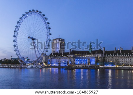 LONDON, UK - JUNE 3, 2013: View of the London Eye at night. London Eye - a famous tourist attraction over river Thames in the capital city London.