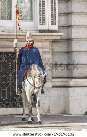 MADRID, SPAIN - NOVEMBER 20, 2013: Spanish Royal Guards participate in the Changing of the Guards outside Madrid\'s Royal Palace in Madrid, capital of Spain.