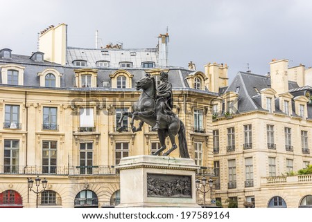 Place des Victoires is a circular place in Paris, located northeast from Palais Royal. At center of Place des Victoires is an equestrian monument in honor of King Louis XIV. France.