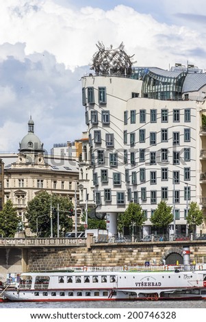 PRAGUE, CZECH REPUBLIC - JUNE 20, 2014: Dancing House (built in 1996) or Fred and Ginger House in the center of Prague. Building was designed by Vlado Milunic and Frank Gehry.