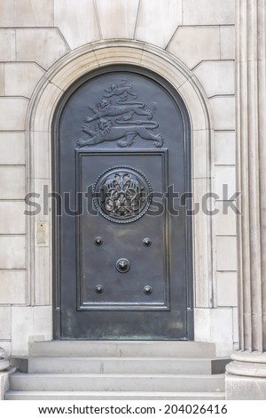 The historical building of the Bank of England, London, UK. Antique doors. Established in 1694, Bank of England is the second oldest central bank in the world.