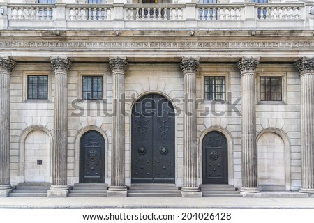 The historical building of the Bank of England, London, UK. Antique doors. Established in 1694, Bank of England is the second oldest central bank in the world.