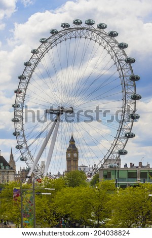 LONDON, UK - MAY 25, 2013: View of the London Eye. London Eye (135 m tall, diameter of 120 m) - a famous tourist attraction over river Thames in the capital city London.