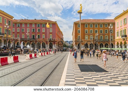 NICE, FRANCE - JULY 7, 2014: People hang around Place Massena in Nice. It is Main Square of the city and it is used for concerts and other events which take place in the city.