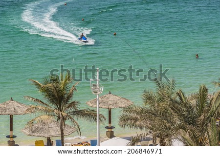SHARJAH, UAE - SEPTEMBER 25, 2012: Sea, beach at 4-star Carlton Hotel in Sharjah. Hotel is sited on the shores of Al Khan beach. Resort features 173 guest rooms and chalets. United Arab Emirates.
