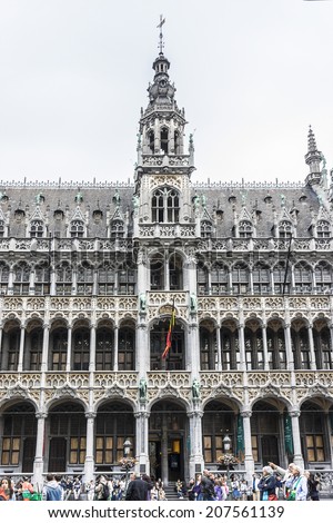 BRUSSELS, BELGIUM - JUNE 19, 2014: Many tourists visiting famous Grand Place (Grote Markt) - the central square of Brussels. Grand Place was named by UNESCO as a World Heritage Site in 1998.