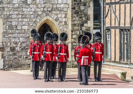 WINDSOR, ENGLAND - MAY 27, 2013: Changing Guard Ceremony takes place in Windsor Castle. British Guards in red uniforms are among the most famous in the world.