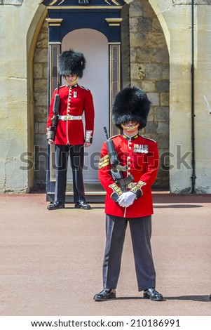 WINDSOR, ENGLAND - MAY 27, 2013: Changing Guard Ceremony takes place in Windsor Castle. British Guards in red uniforms are among the most famous in the world.