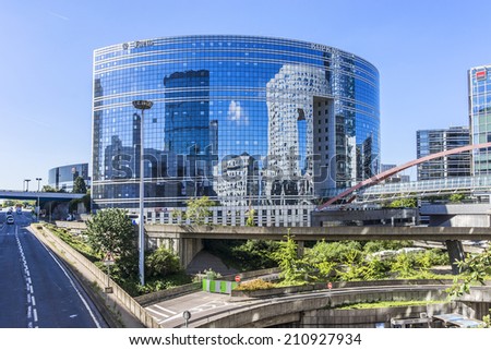 PARIS, FRANCE - MAY 15, 2014: Skyscrapers in business district of Defense to the west of Paris. Defense is biggest business district in France and most of large companies have offices here.