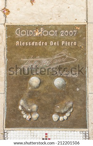 MONACO - JULY 8, 2014: Winner of Golden Foot award (international prize awarded to footballers) leaves a permanent mould of his footprints on \