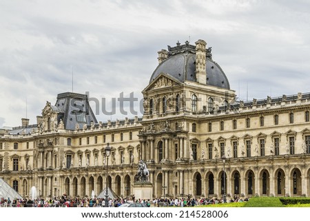 PARIS - JULY 13, 2012: Louvre building in Louvre Museum. Louvre - one of the world\'s largest museums and most visited art museum in the world. France.