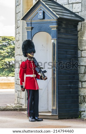WINDSOR, ENGLAND - MAY 27, 2013: Changing Guard takes place in Windsor Castle. British Guards in red uniforms are among the most famous in the world.