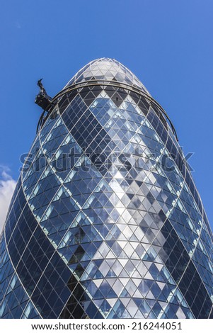 LONDON, UK - JUNE 3, 2013: View of Gherkin building (or 30 St Mary Axe, 2004) in London. Gherkin - iconic symbol of London, one of city's most widely recognized examples of modern architecture.