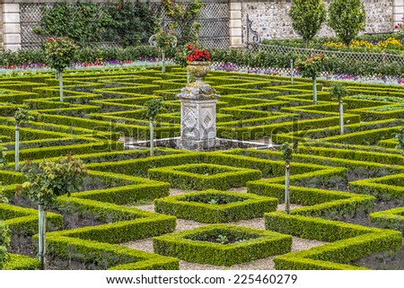 VILLANDRY, FRANCE - JULY 20, 2012: Traditional French garden in Chateau de Villandry. Chateau de Villandry (castle-palace) in department of Indre-et-Loire - world known for its amazing gardens.