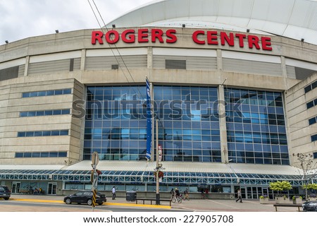 TORONTO, CANADA - JULY 23, 2014: View of Rogers Centre (or SkyDome, opened in 1989). Rogers Centre is a multi-purpose stadium situated next to CN Tower in downtown Toronto, Ontario.