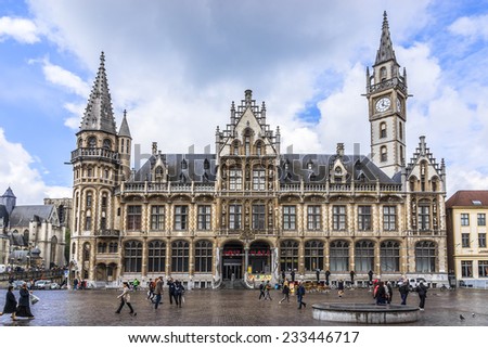 GHENT, BELGIUM - MAY 12, 2014: Tourists in city center of Ghent. Ghent is a city and a municipality located in the Flemish region of Belgium.