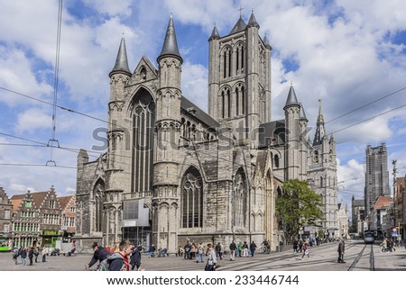 GHENT, BELGIUM - MAY 12, 2014: Tourists in city center of Ghent. Ghent is a city and a municipality located in the Flemish region of Belgium.